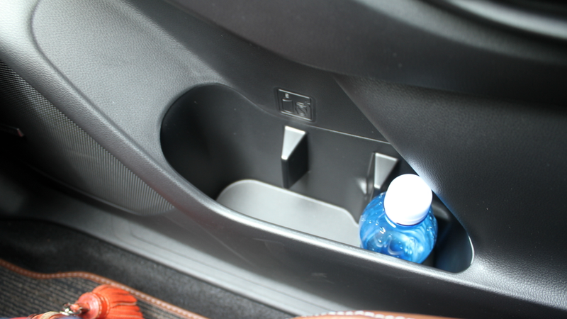 Surprise! That third hole technically isn’t a cupholder, but can sometimes work with smaller bottles and cans.